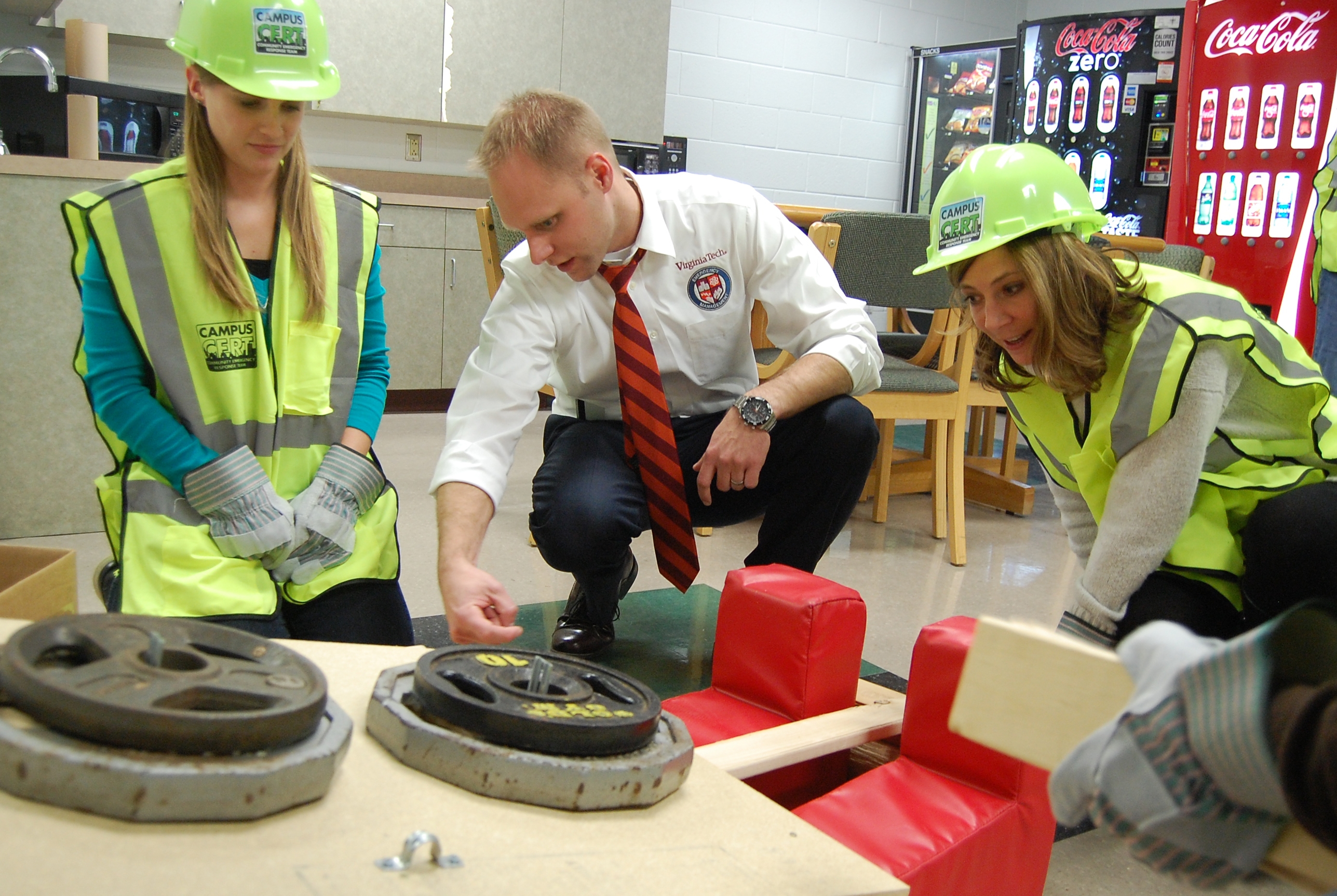 Image of VTEM leader with 2 students during training