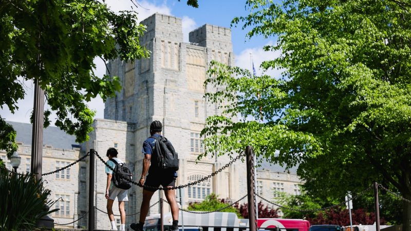 Students walk near Virginia Tech's Burruss Hall in spring 2024.